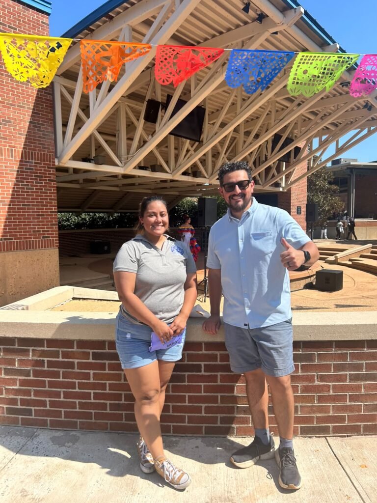 Cecilia Barrios and DJ Jesse Ramos stand together at the Chattanooga State amphitheater during Latin Fest.