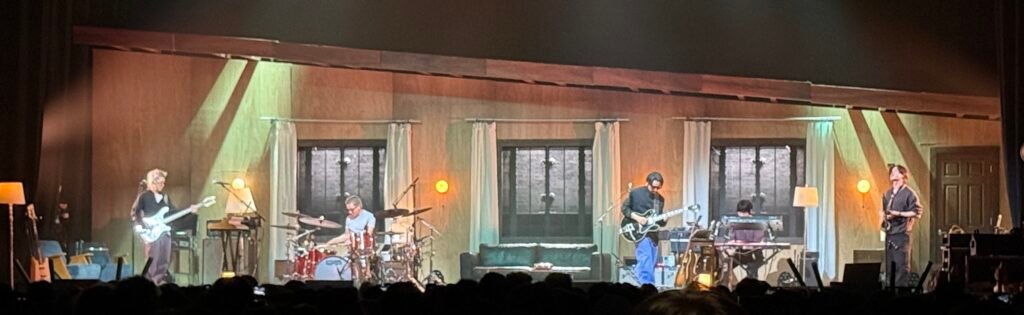 wave to earth performs on a house-themed stage at Coca-Cola Roxy in Atlanta.