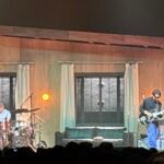 wave to earth performs on a house-themed stage at Coca-Cola Roxy in Atlanta.